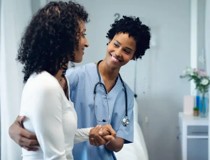 female-doctor-helping-patient-to-walk-ward-hospital-front-view-happy-african-american-152083392.jpg